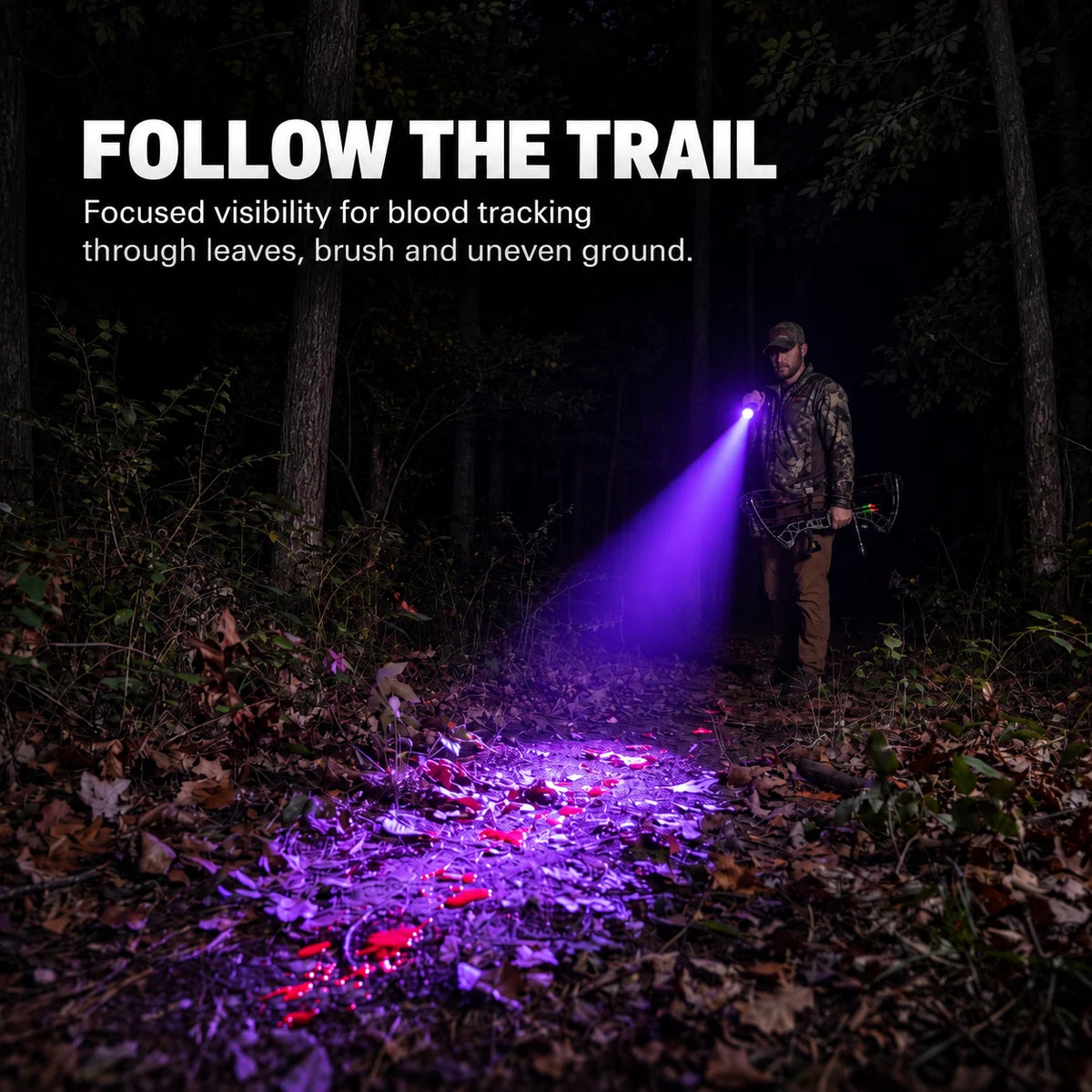 FIELDLUME B1 blood tracking light used by a hunter to follow a blood trail through leaves and brush at night