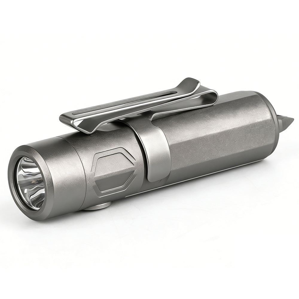 Titanium flashlight with a clip on a white background