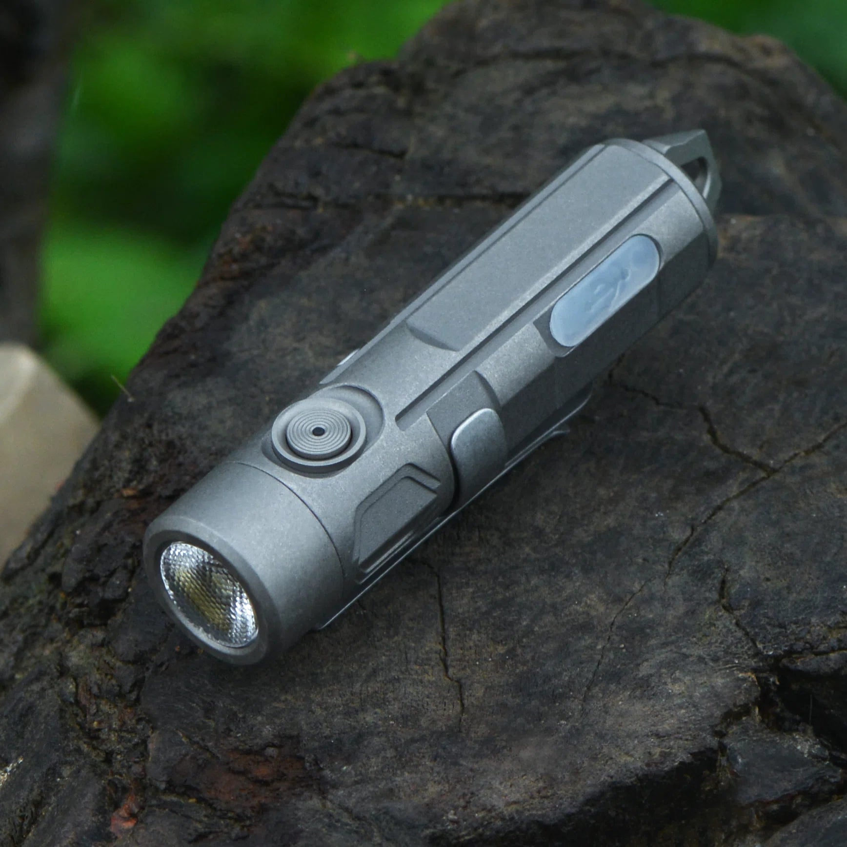 FIELDLUME T2 compact titanium flashlight showing pocket-size EDC design