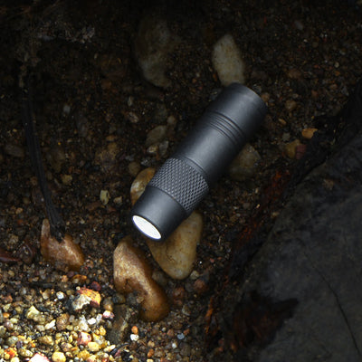 FIELDLUME T3 compact titanium flashlight shown for everyday carry