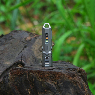 FIELDLUME T4 titanium EDC torch complete product angle with multi-colour lighting