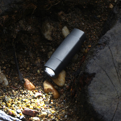 FIELDLUME T7 titanium flashlight close-up with machined finish